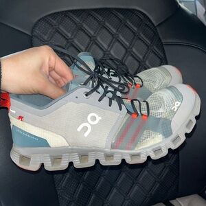 On Running Gray and Red Sneakers